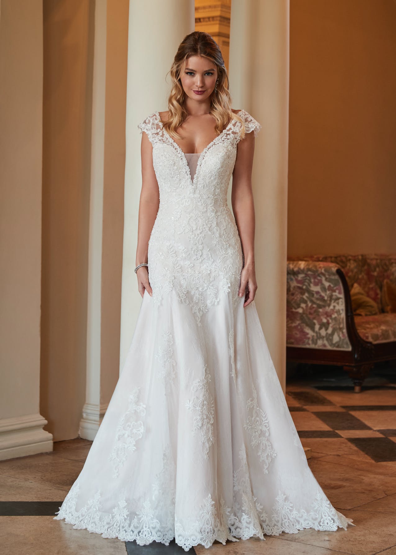 Reese is a timeless fit and flare wedding dress with cap sleeves