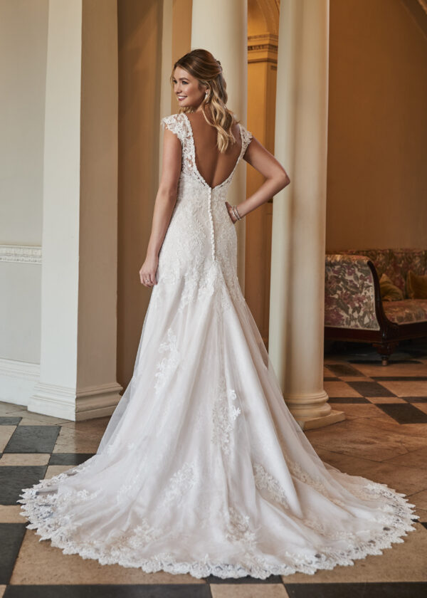 Reese is a timeless fit and flare wedding dress with cap sleeves