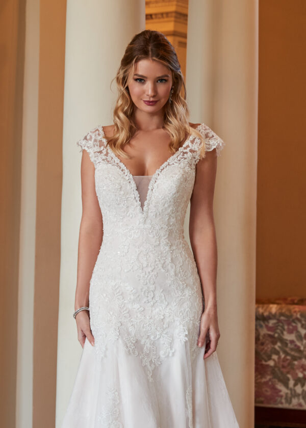 Reese is a timeless fit and flare wedding dress with cap sleeves