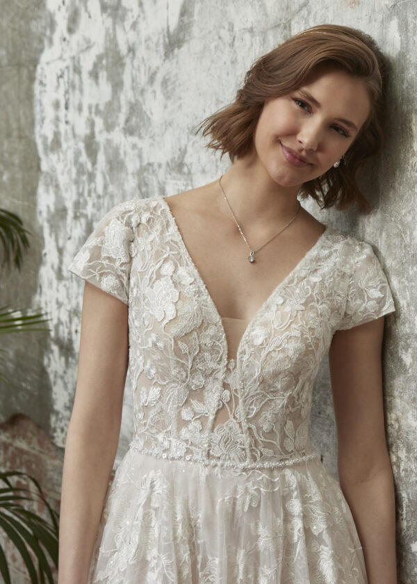venice Lovely floral lace dress with plunging neckline and A-line silhouette complete with sequined underlace